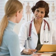 woman at postpartum doctors visit